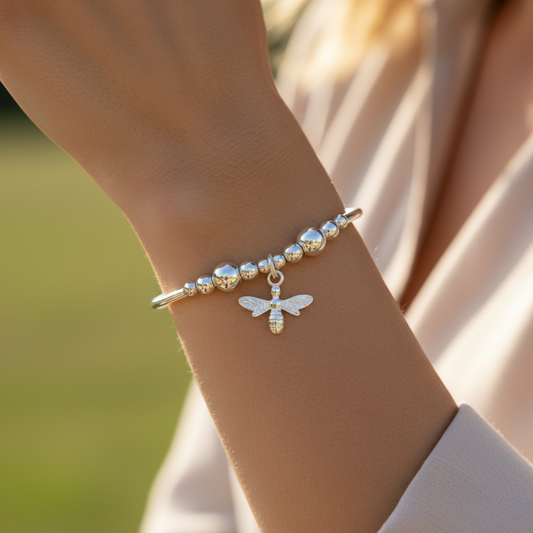Woman wearing a Bee charm sterling silver stacking stretch bracelet for her by My Silver Wish