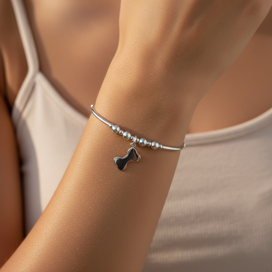 Model wearing a Dog Bone Charm Women's Sterling Silver Stacking Bracelet by My Silver Wish