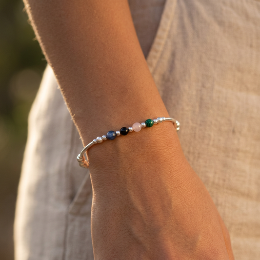 Model wearing a Anxiety support healing crystal sterling silver women's stacking charm bracelet by My Silver Wish