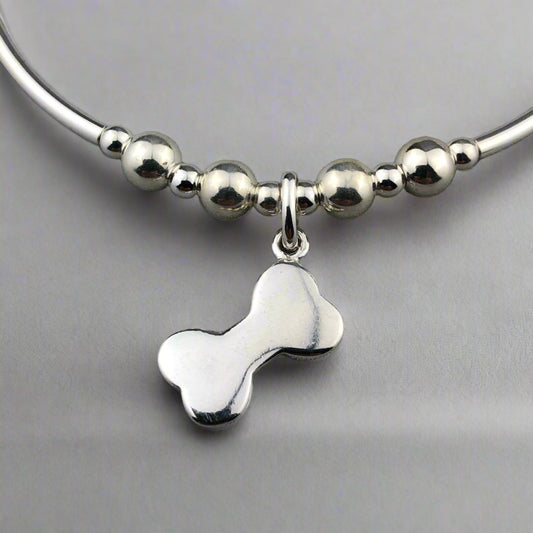 Closeup of Dog Bone Charm Women's Sterling Silver Stacking Bracelet by My Silver Wish