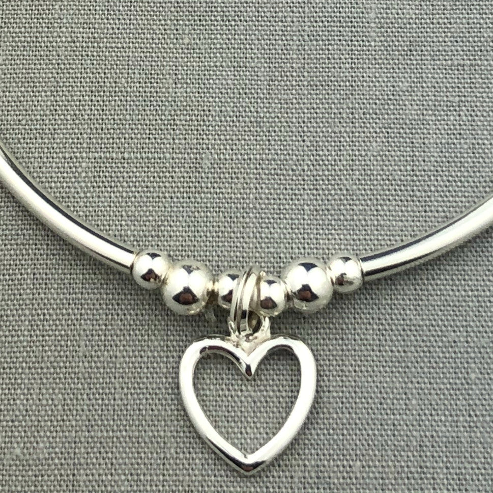 Closeup of Open heart charm sterling silver stacking charm bracelet by My Silver Wish