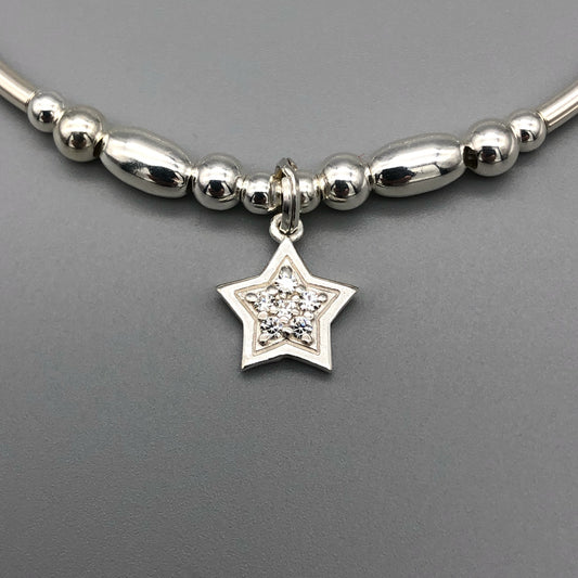 Closeup of Star charm sterling silver hand-made women's stacking bracelet by My Silver Wish