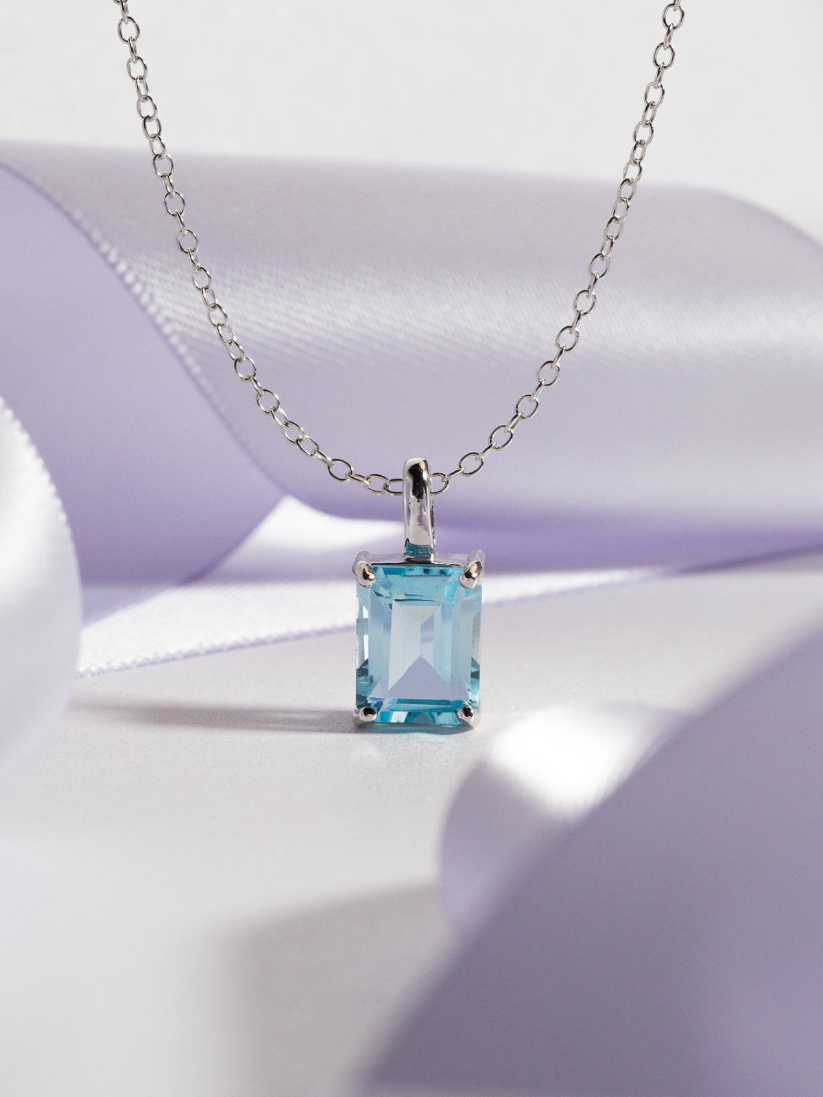 Blue Topaz Emerald Cut Pendant Necklace in Sterling Silver