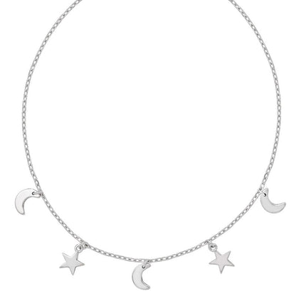 Silver necklace with moon and star charms on a white background
