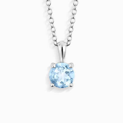 Silver necklace with a blue gemstone pendant on a white background