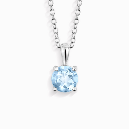 Silver necklace with a blue gemstone pendant on a white background