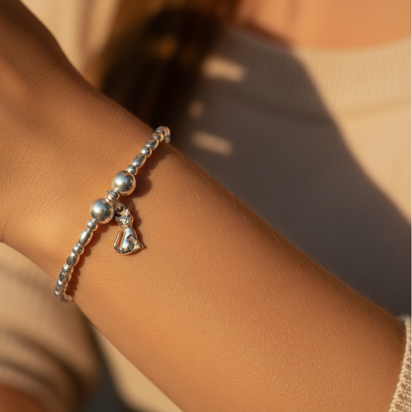 Woman wearing a Cat charm sterling silver stacking bracelet for her by My Silver Wish