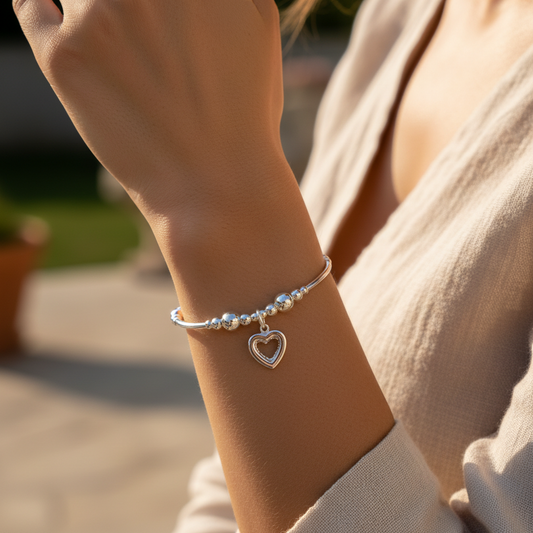 Model wearing a Crystal heart charm sterling silver hand-made stacking bracelet for her by My Silver Wish