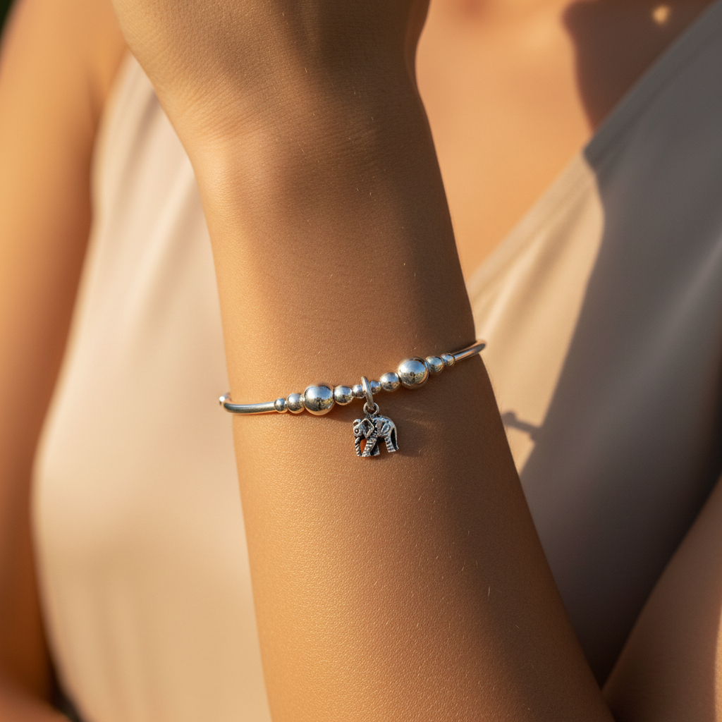 Model wearing a Elephant Charm Children's Sterling Silver Stacking Bracelet by My Silver Wish