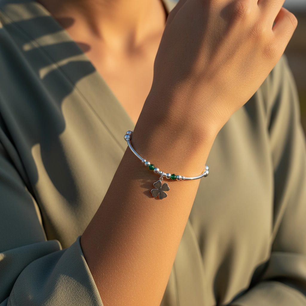 Model wearing a "Good Luck" charm four leaf clover sterling silver hand-made stacking bracelet by My Silver Wish