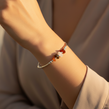 Woman wearing a Confidence healing crystal and sterling silver women's stacking charm bracelet by My Silver Wish