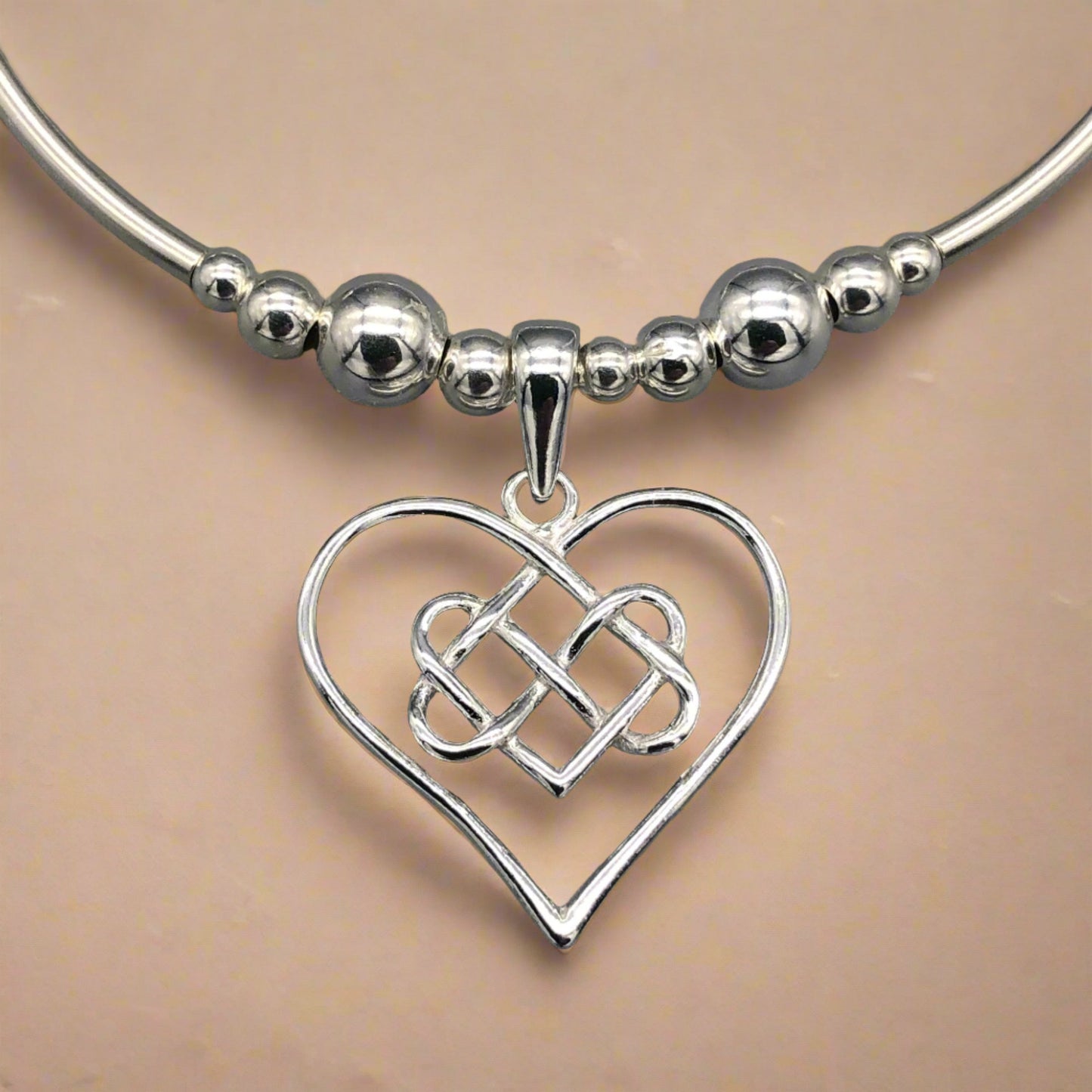 Closeup of Infinity heart charm sterling silver stacking bracelet for her by My Silver Wish