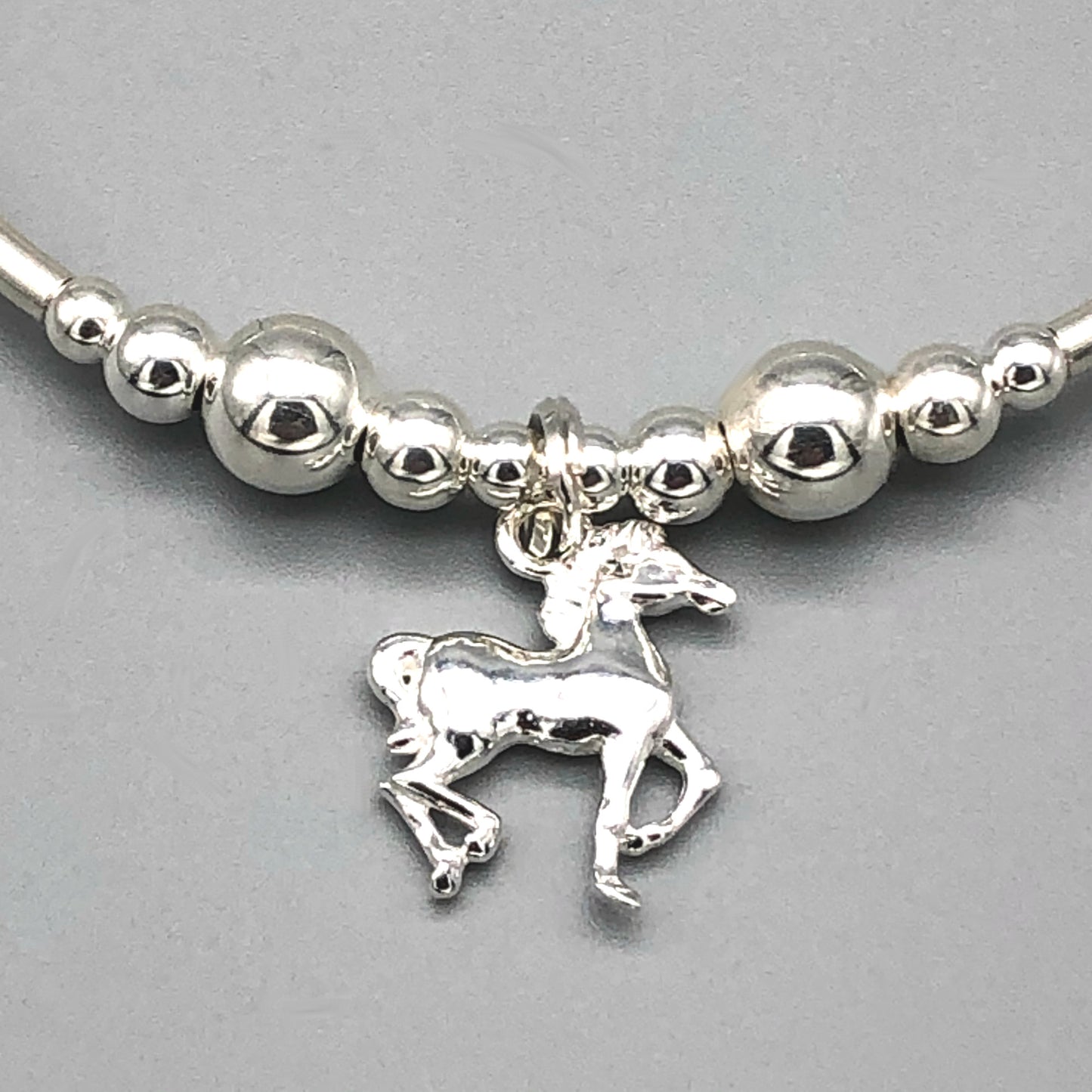 Closeup of Horse charm sterling silver stacking bracelet for her by My Silver Wish