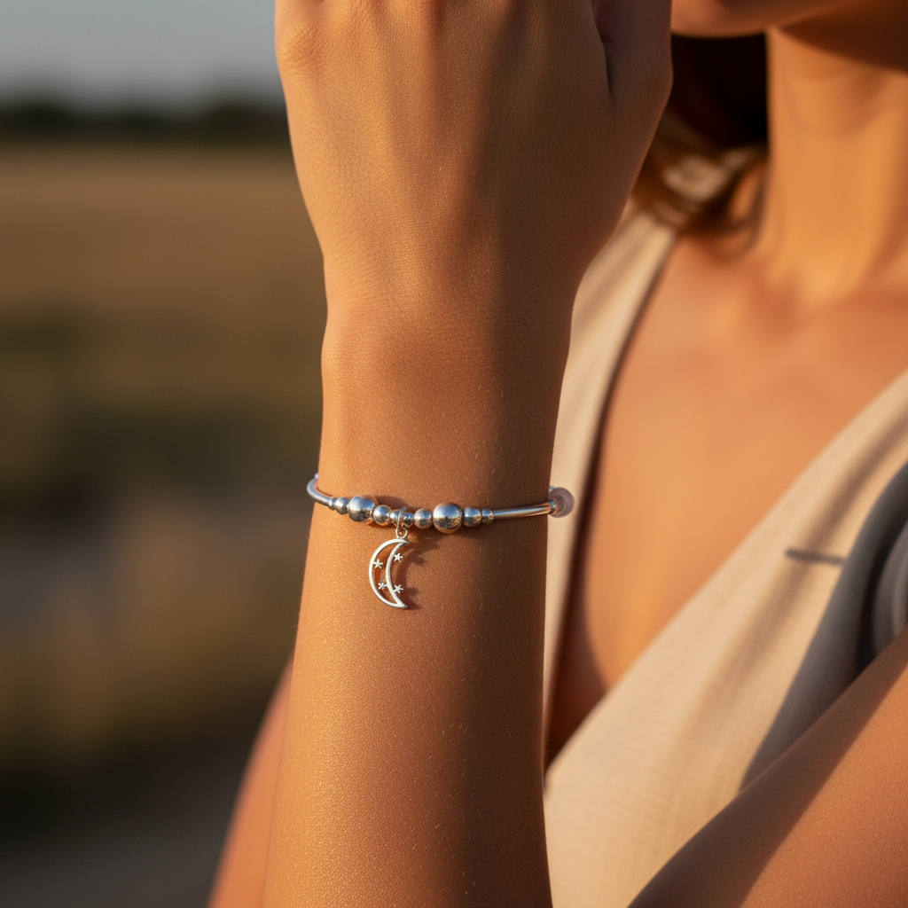 Woman wearing a Moon & Stars Charm Women's Moonstone Rose Quartz Silver Stacking Bracelet by My Silver Wish