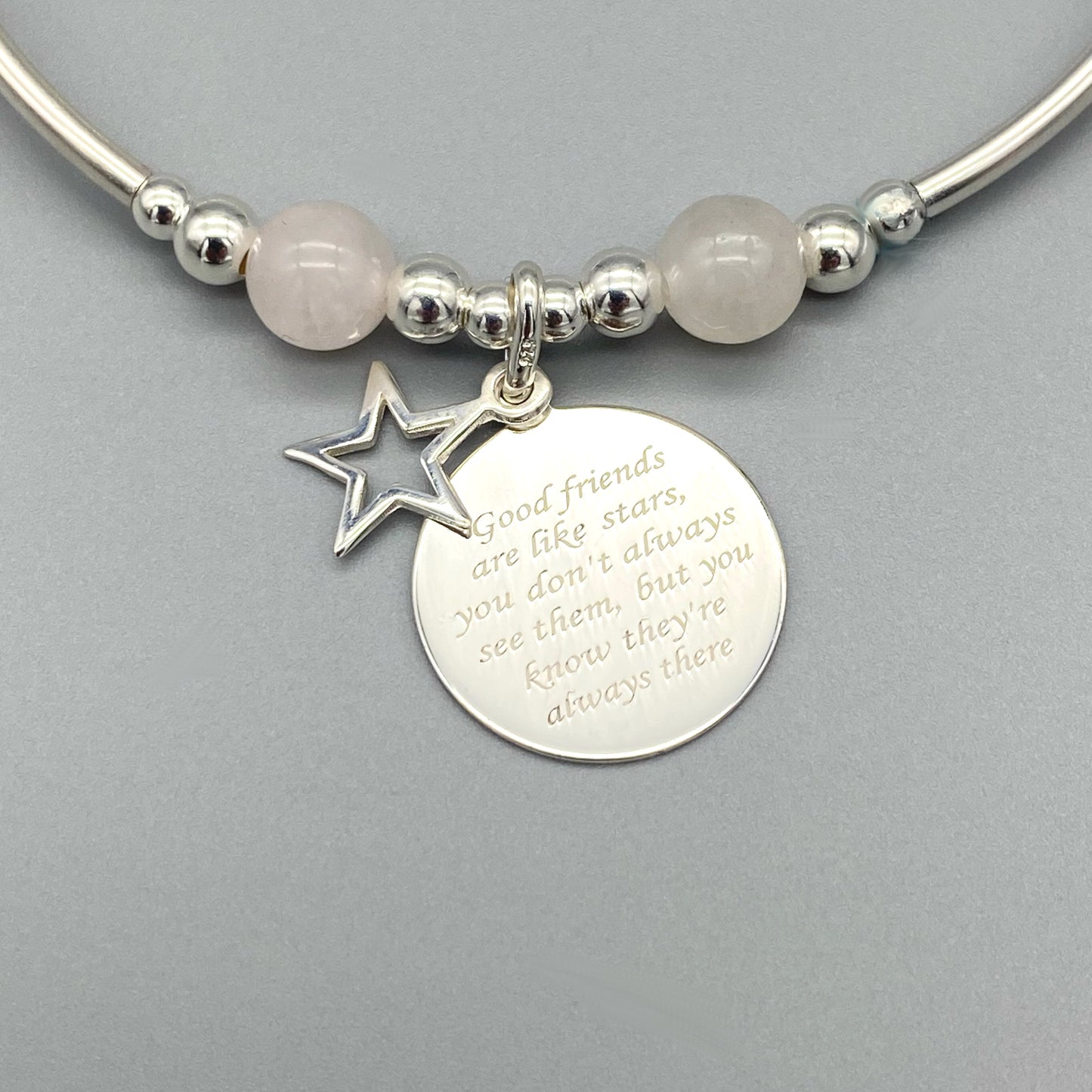 Closeup of "Friends are like stars..." charm rose quartz & sterling silver women's stacking bracelet by My Silver Wish