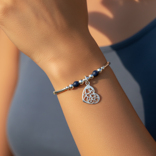 Model wearing a Heart charm filigree sterling silver & sodalite gemstone women's stacking bracelet by My Silver Wish