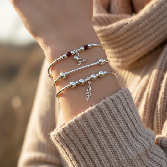 Model wearing a Loved Ones are Near when Feathers and Robins are Near, silver stacking bracelet set by My Silver Wish