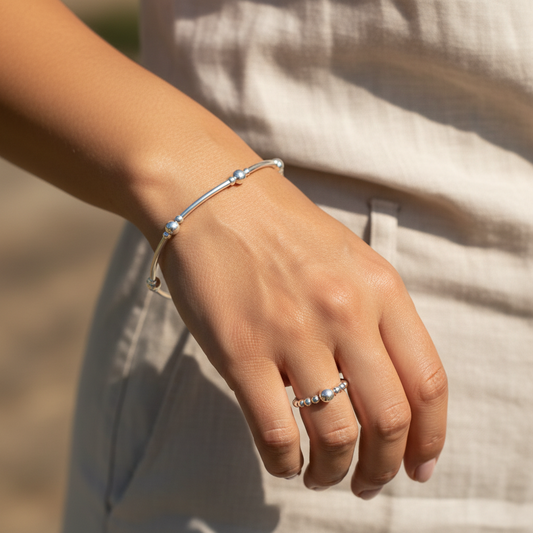 Model wearing a Sterling silver women's stacking filler bracelet & ring set by My Silver Wish