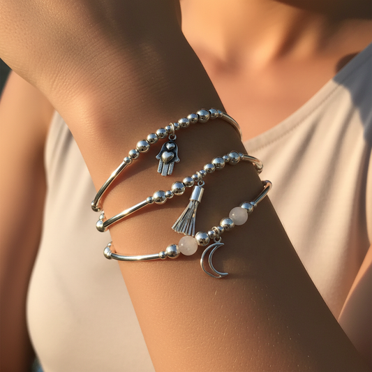 Model wearing a "Raise your Spirits" Sterling Silver Charm Stacking Bracelet Set by My Silver Wish