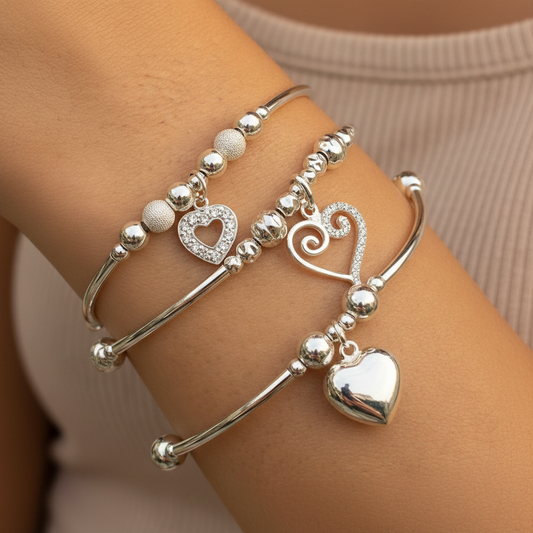 Model wearing a Heart Charms Women's Sterling Silver Stacking Bracelet Set by My Silver Wish
