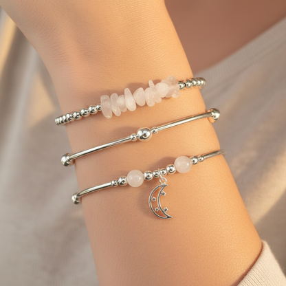 Woman wearing a "Feminine Energy" Women's Sterling Silver Stacking Charm Bracelet Set by My Silver Wish