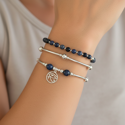 Woman wearing an "Intuition and Insight" Women's Sterling Silver Stacking Charm Bracelet Set by My Silver Wish