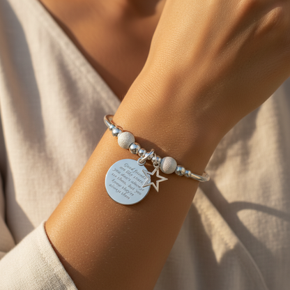 Model wearing a "Good friends are like stars..." sterling silver stacking bracelet for her by My Silver Wish