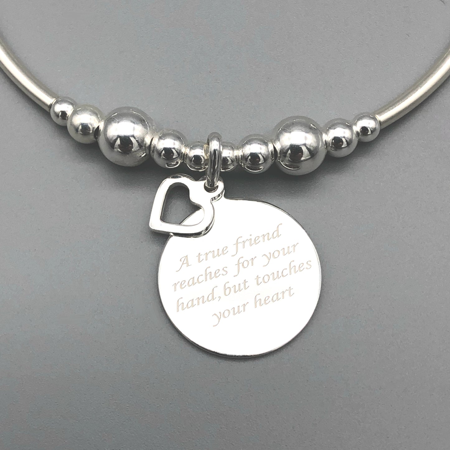 "A true friend reaches for your hand, but touches your heart" women's sterling silver stacking bracelet by My Silver Wish