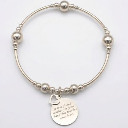 "A true friend reaches for your hand, but touches your heart" women's sterling silver stacking bracelet by My Silver Wish