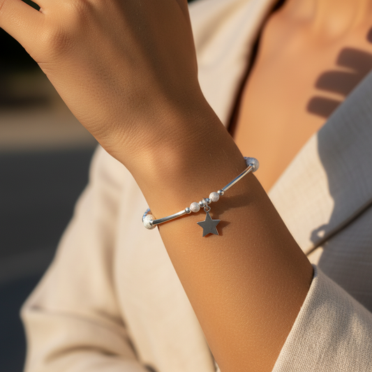 Model wearing a Star charm & starburst beads sterling silver stacking bracelet for her by My Silver Wish