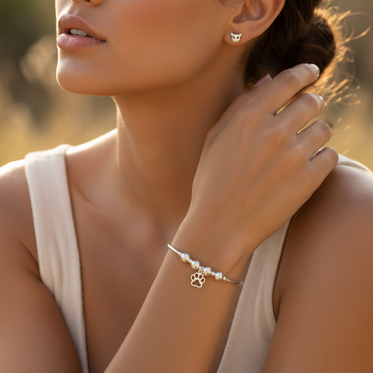 Model wearing a Cat charm sterling silver stacking bracelet and stud earring women's jewellery gift set by My Silver Wish