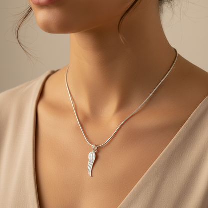 Woman wearing a Sterling Silver Necklace with Angel Wing Pendant by My Silver Wish
