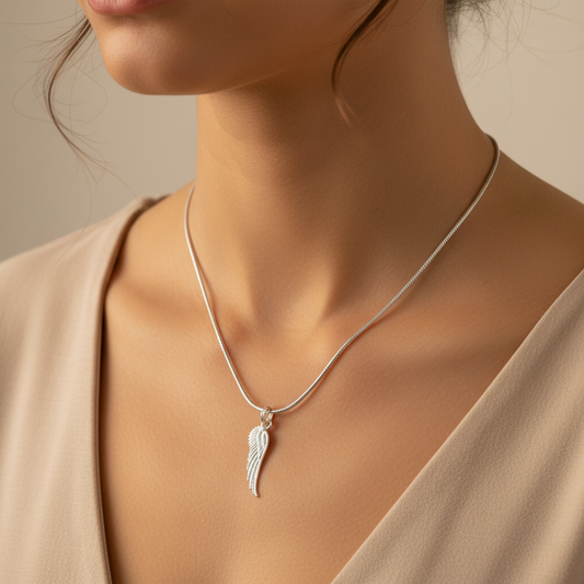 Woman wearing a Sterling Silver Necklace with Angel Wing Pendant by My Silver Wish