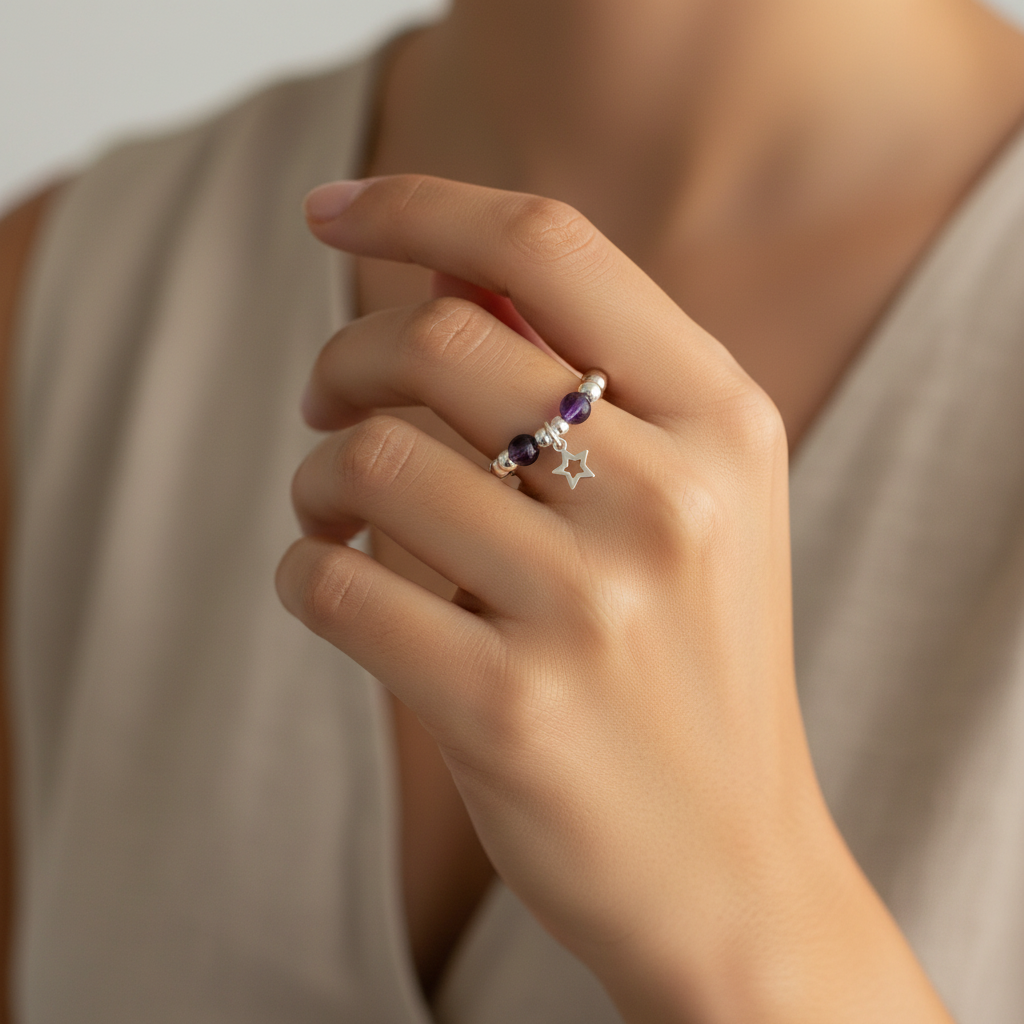 Model wearing a Star charm amethyst sterling silver charm women's bead stacking ring by My Silver Wish