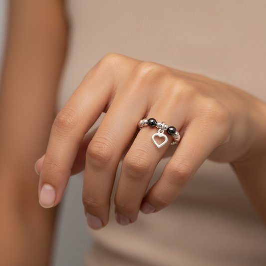 Woman wearing a Heart charm hematite & sterling silver beads women's stacking ring by My Silver Wish