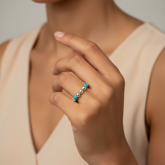 Woman wearing a Turquoise Healing Gemstone Beads & Sterling Silver Stacking Ring
