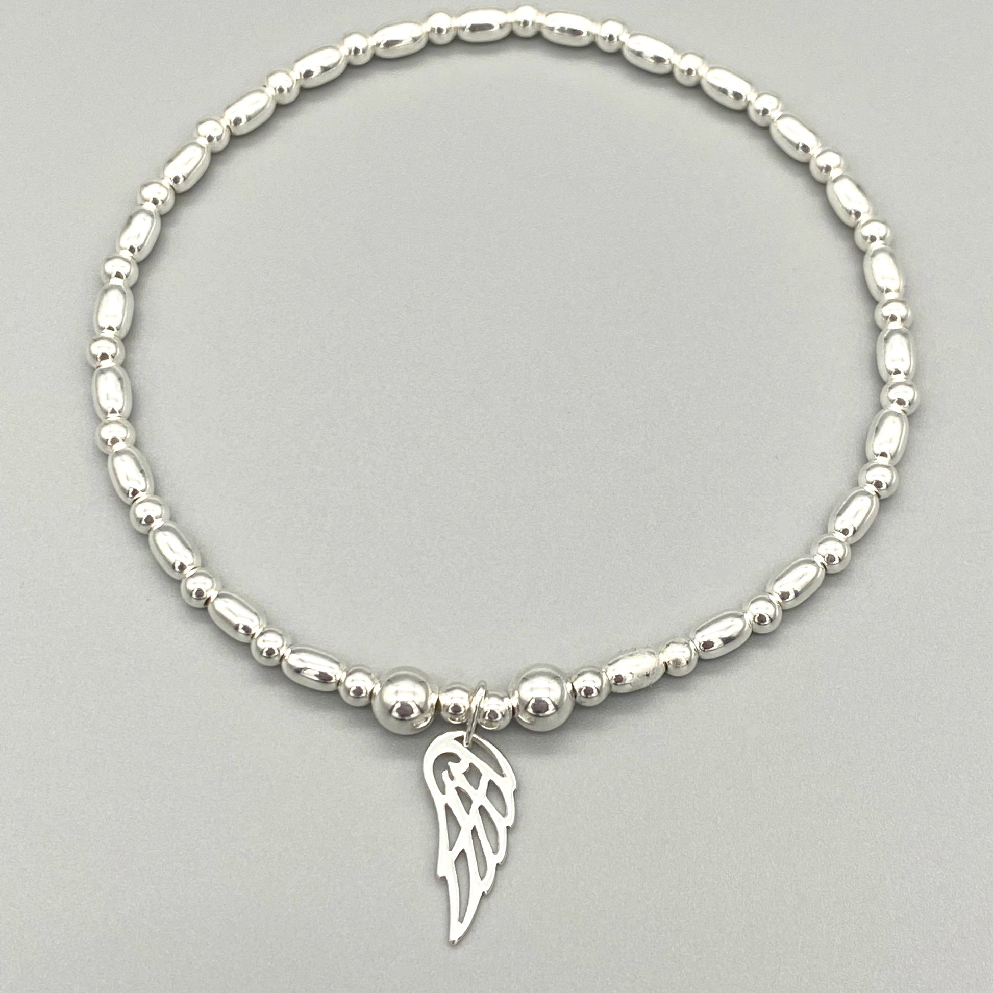 Angel wing charm women's sterling silver stacking bracelet by My Silver Wish