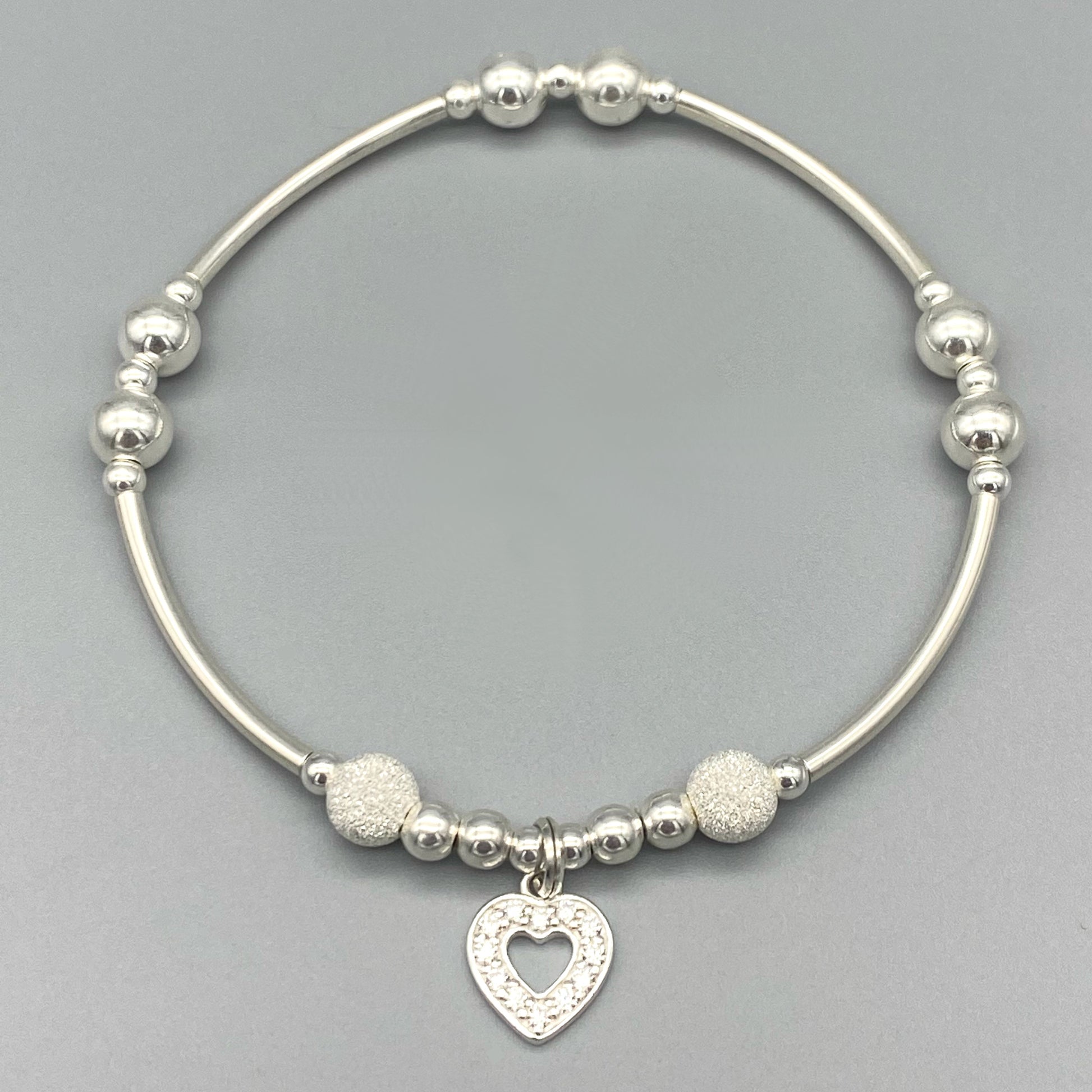 Diamond heart charm and starburst beads women's sterling silver stacking bracelet by My Silver Wish
