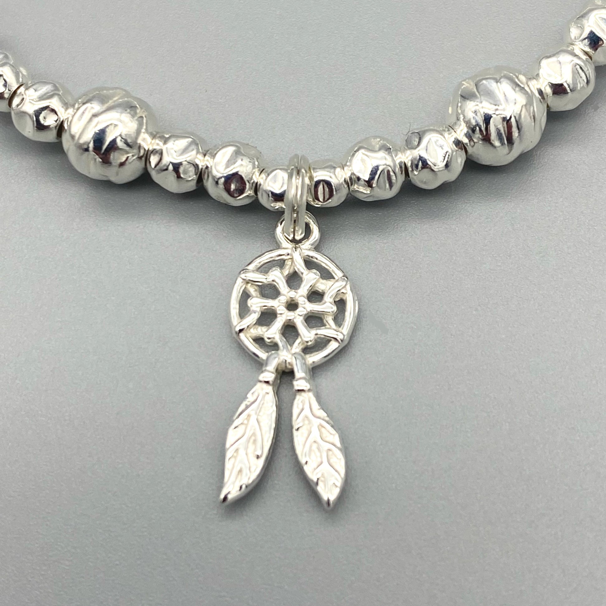 Closeup of Dreamcatcher charm sterling silver stacking bracelet for her by My Silver Wish