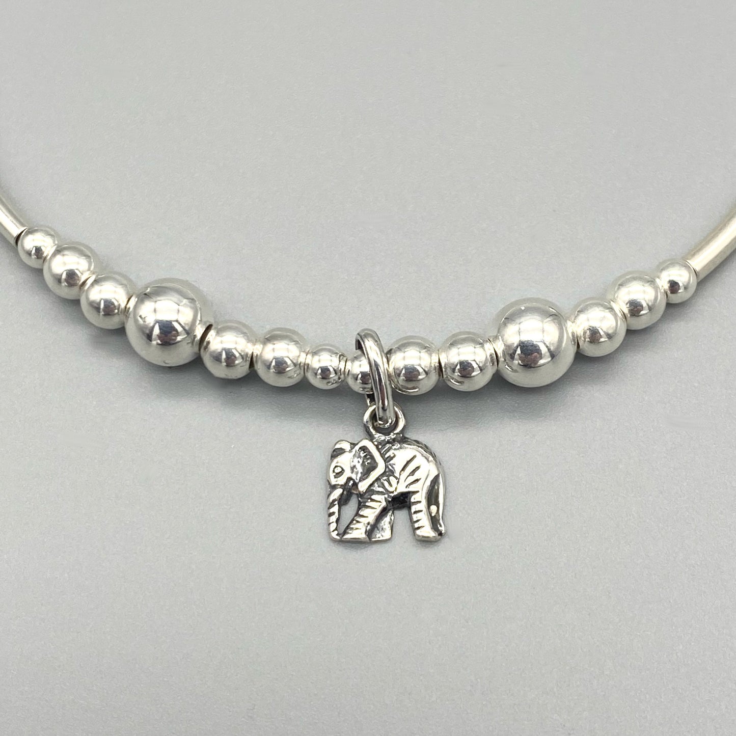 Closeup of Elephant charm sterling silver women's stacking bracelet by My Silver Wish