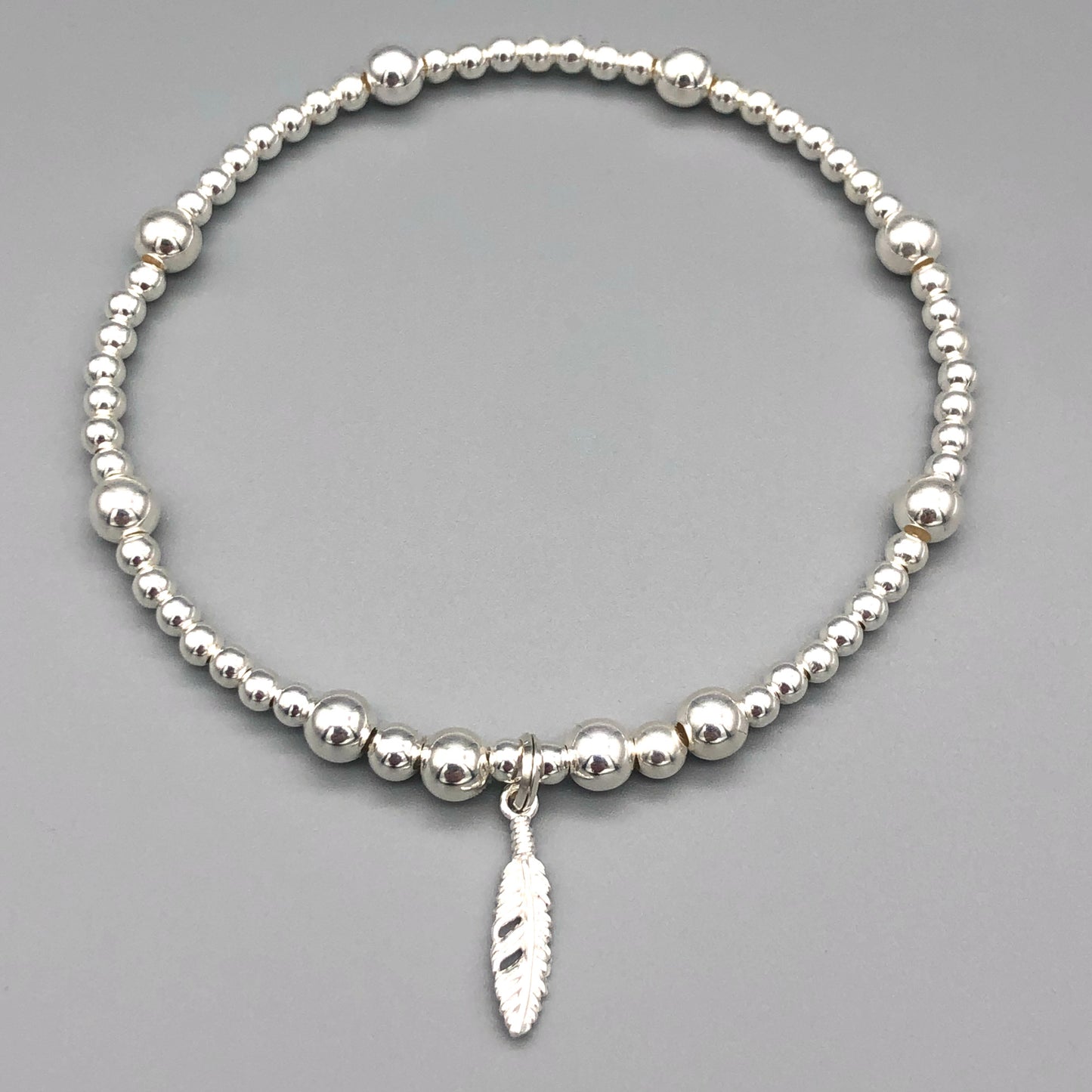 Feather charm women's 925 sterling silver stacking bracelet by My Silver Wish