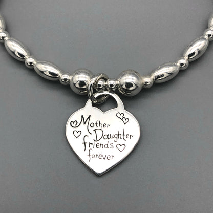 Closeup of "Mother & daughter, friends forever" charm sterling silver women's stacking bracelet by My Silver Wish