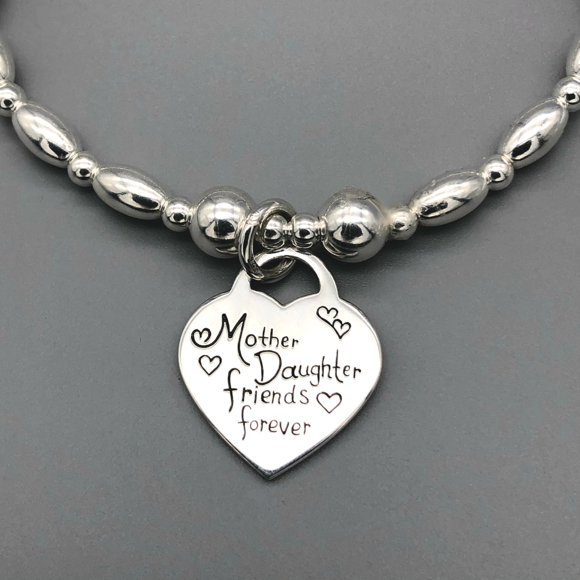 Closeup of "Mother Daughter Friends Forever" charm women's hand-made sterling silver charm bracelet by My Silver Wish