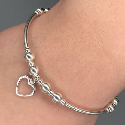Closeup of Small open heart sterling silver stacking charm bracelet by My Silver Wish