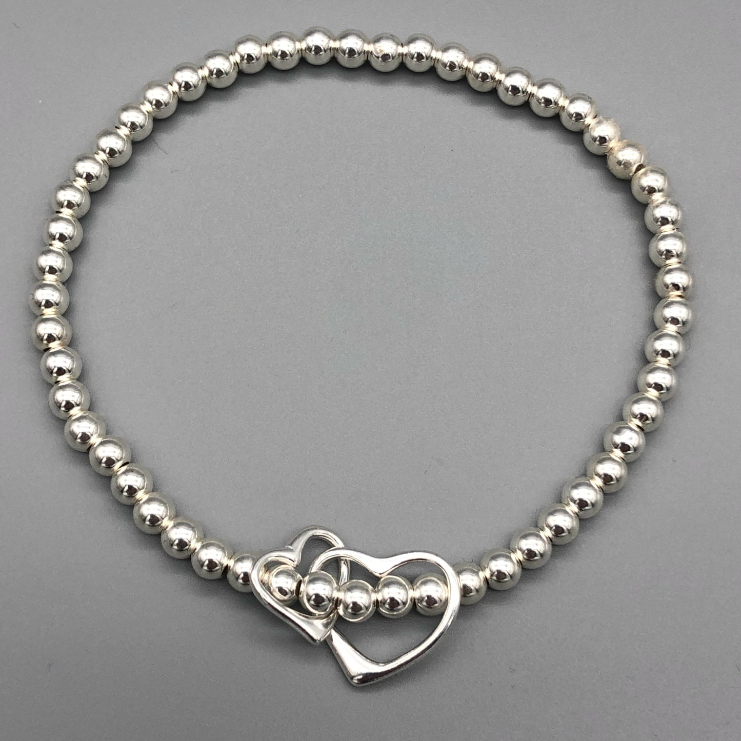 Interlinked open heart charm sterling silver hand-made women's stacking bracelet