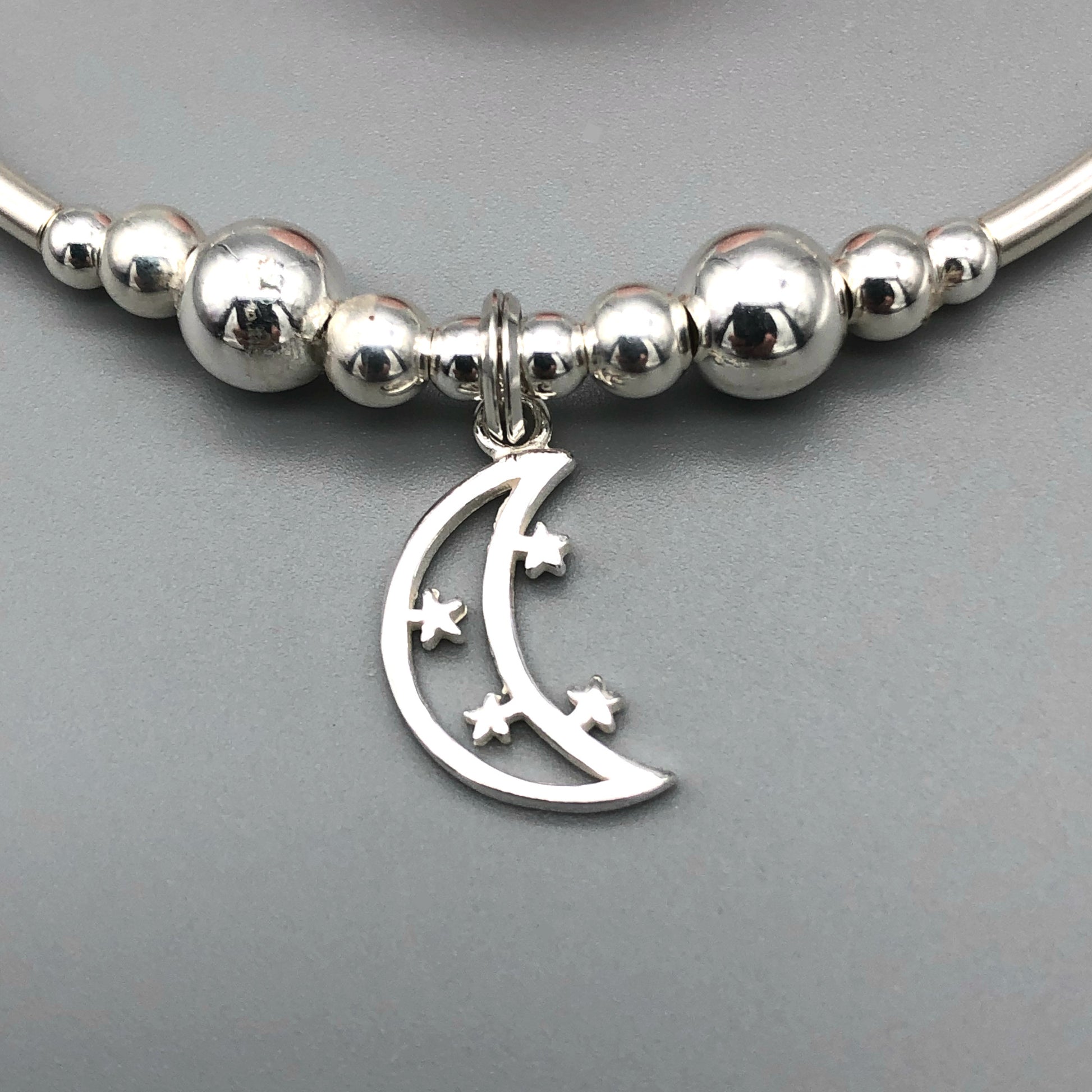 Closeup of Moon & Stars Charm Women's Moonstone Rose Quartz Silver Stacking Bracelet by My Silver Wish