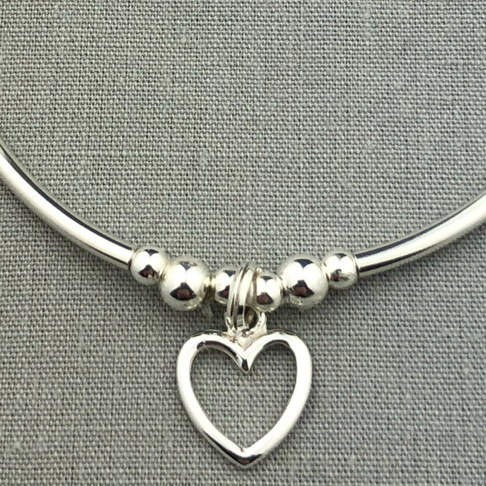 Closeup of Open heart charm sterling silver stacking charm bracelet by My Silver Wish