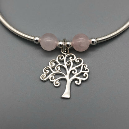 Closeup of Tree of Life charm rose quartz & silver women's stacking charm bracelet by My Silver Wish