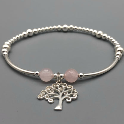 Closeup of Tree of Life charm rose quartz & silver women's stacking charm bracelet by My Silver Wish