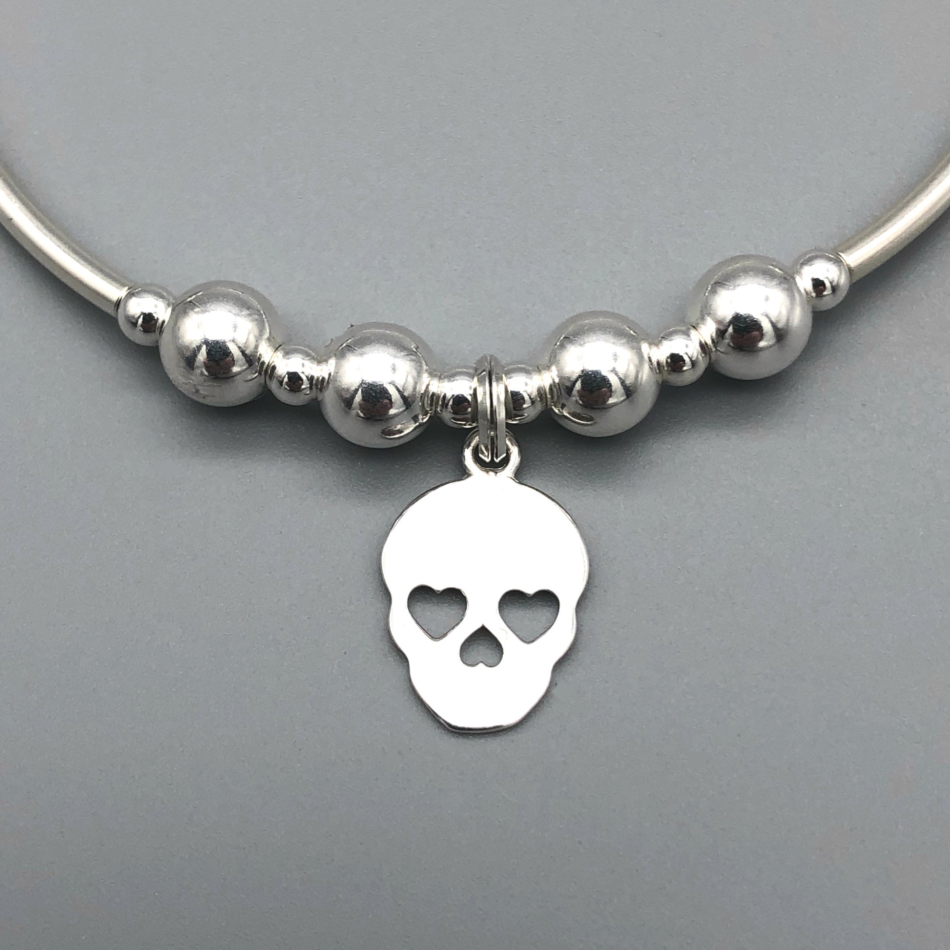 Closeup of Skull charm sterling silver hand-made women's stacking bracelet by My Silver Wish